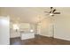 Bright living space with open floor plan, vaulted ceiling, and hardwood floors throughout at 482 West Ave, Bowdon, GA 30108