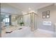 Luxurious bathroom features a large soaking tub, glass shower, and modern fixtures at , Atlanta, GA 30305