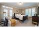 Sunlit bedroom featuring French doors, a sitting area, and ample natural light at , Atlanta, GA 30305