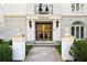 Elegant building entrance with decorative columns, manicured landscaping, and Halten Hall sign at , Atlanta, GA 30305