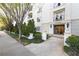 Elegant condo building with manicured landscaping, stone entrance, and classic architectural details at , Atlanta, GA 30305