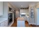 Bright kitchen with stainless steel appliances, hardwood floors, and ample storage space at , Atlanta, GA 30305