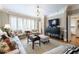 Spacious living room with comfortable seating, large windows, and a sleek entertainment center at , Atlanta, GA 30305