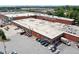 Aerial view of a commercial building featuring 'Monday Night Garage' and 'Whiskey' signage, surrounded by parking and greenery at 1514 Rogers Sw Ave, Atlanta, GA 30310