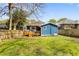 Beautiful backyard view with a charming deck, lush greenery, and privacy fence at 1514 Rogers Sw Ave, Atlanta, GA 30310