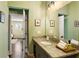 Updated bathroom boasts granite countertops, modern fixtures, and a view of the bedroom at 1514 Rogers Sw Ave, Atlanta, GA 30310