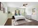 Bright bedroom features hardwood floors, ceiling fan, and an exterior door that allows for natural light at 1514 Rogers Sw Ave, Atlanta, GA 30310