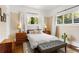 Inviting bedroom with hardwood floors, neutral walls, lots of light, and tasteful furnishings at 1514 Rogers Sw Ave, Atlanta, GA 30310