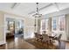 Dining room featuring coffered ceilings, hardwood floors, and a view into the adjacent living room at 1514 Rogers Sw Ave, Atlanta, GA 30310