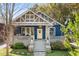 Charming blue craftsman home featuring a welcoming front porch and well-maintained landscaping at 1514 Rogers Sw Ave, Atlanta, GA 30310