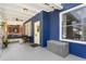 Inviting front porch featuring a porch swing, blue brick, and stone columns at 1514 Rogers Sw Ave, Atlanta, GA 30310