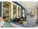 Cozy front porch with swing, wicker seating, and charming blue brick exterior at 1514 Rogers Sw Ave, Atlanta, GA 30310