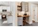 Charming butler's pantry with custom cabinetry, wine rack and counter space adjacent to the modern kitchen at 1514 Rogers Sw Ave, Atlanta, GA 30310