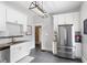 Spacious, updated kitchen with stainless steel appliances, granite counters, and stylish white cabinets at 1514 Rogers Sw Ave, Atlanta, GA 30310