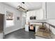 Bright updated kitchen features gray tile floor, stainless steel appliances, granite counters, and ample cabinets at 1514 Rogers Sw Ave, Atlanta, GA 30310
