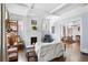 Bright living room featuring a decorative fireplace, hardwood floors, and an open floorplan at 1514 Rogers Sw Ave, Atlanta, GA 30310
