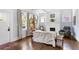Bright living room with hardwood floors, white fireplace, and ample natural light at 1514 Rogers Sw Ave, Atlanta, GA 30310