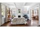 Inviting living room featuring hardwood floors, a brick fireplace, and lots of natural light at 1514 Rogers Sw Ave, Atlanta, GA 30310