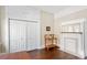 This office features hardwood floors, a closet, a fireplace, and a neutral color scheme at 1514 Rogers Sw Ave, Atlanta, GA 30310