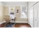 This office features hardwood floors, a closet, a window, and an ergonomic office chair at 1514 Rogers Sw Ave, Atlanta, GA 30310