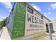 Vibrant exterior of West End Brewery & Gardens, advertising Tacos and Beer at 1514 Rogers Sw Ave, Atlanta, GA 30310