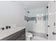 Bathroom featuring a glass-enclosed shower, sleek vanity, and toilet, providing a stylish space at 247 Old Timber Rd, Lawrenceville, GA 30046