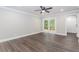 Bedroom with modern floors, fan, and private balcony access at 247 Old Timber Rd, Lawrenceville, GA 30046