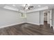 Bedroom showcasing dark wood-look tile floors, recessed lights, and a neutral color scheme at 247 Old Timber Rd, Lawrenceville, GA 30046