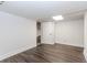 Finished room with a drop ceiling, wood-look floors, and painted paneling at 247 Old Timber Rd, Lawrenceville, GA 30046