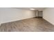Neutral room features modern flooring, white painted paneling, and open doorway at 247 Old Timber Rd, Lawrenceville, GA 30046
