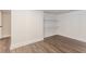 Finished room with wood-look floors, white walls, and storage shelving at 247 Old Timber Rd, Lawrenceville, GA 30046