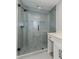 Contemporary glass shower with gray tiling and stylish fixtures at 247 Old Timber Rd, Lawrenceville, GA 30046