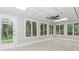 Bright sunroom filled with natural light from many windows and a tile floor at 247 Old Timber Rd, Lawrenceville, GA 30046
