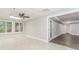 Bright sunroom leading to the basement area that features tile floors and many windows at 247 Old Timber Rd, Lawrenceville, GA 30046