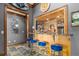 Entertain in style with this home bar featuring custom wood cabinetry and a granite countertop at 6316 Woodlake Dr, Buford, GA 30518