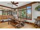 Dining room with view to the outside, natural light, decorative trim and hardwood floors at 6316 Woodlake Dr, Buford, GA 30518