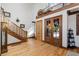 Inviting foyer with hardwood floors, a staircase, and high ceilings, creating a grand entrance at 6316 Woodlake Dr, Buford, GA 30518