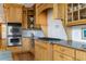 Gourmet kitchen with stainless steel appliances, granite counters, and custom cabinets at 6316 Woodlake Dr, Buford, GA 30518
