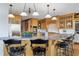 Well-lit kitchen featuring granite countertops, stainless steel appliances, and wood cabinets at 6316 Woodlake Dr, Buford, GA 30518