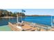 Lake view from boat dock featuring outdoor seating perfect for relaxing and enjoying the scenery at 6316 Woodlake Dr, Buford, GA 30518