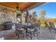 Enjoy outdoor dining on this patio with a stone wall and grill, perfect for entertaining at 6316 Woodlake Dr, Buford, GA 30518