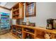 Convenient pantry with custom cabinets, refrigerator and storage space at 6316 Woodlake Dr, Buford, GA 30518