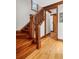 Elegant staircase with hardwood steps and ornate railing at 6316 Woodlake Dr, Buford, GA 30518