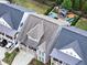 Aerial view of a lovely property featuring a pool, gazebo, and well-manicured landscaping nestled between charming homes at 319 Riverton Way, Woodstock, GA 30188