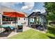 Landscaped backyard showcasing a gazebo, lounge area, and outdoor furniture at 319 Riverton Way, Woodstock, GA 30188