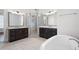 Beautiful bathroom featuring a large glass shower, dual vanity, and a soaking tub at 319 Riverton Way, Woodstock, GA 30188
