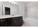 Modern bathroom with vanity, shower and tub combination, and tile flooring at 319 Riverton Way, Woodstock, GA 30188