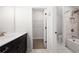 A full bathroom including a bath tub and a walk-in closet for storage at 319 Riverton Way, Woodstock, GA 30188
