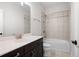 Bathroom with a shower over the bath, a mirror, and a single sink at 319 Riverton Way, Woodstock, GA 30188