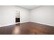 Spacious bedroom featuring hardwood floors and neutral walls, offering a versatile space to personalize at 319 Riverton Way, Woodstock, GA 30188